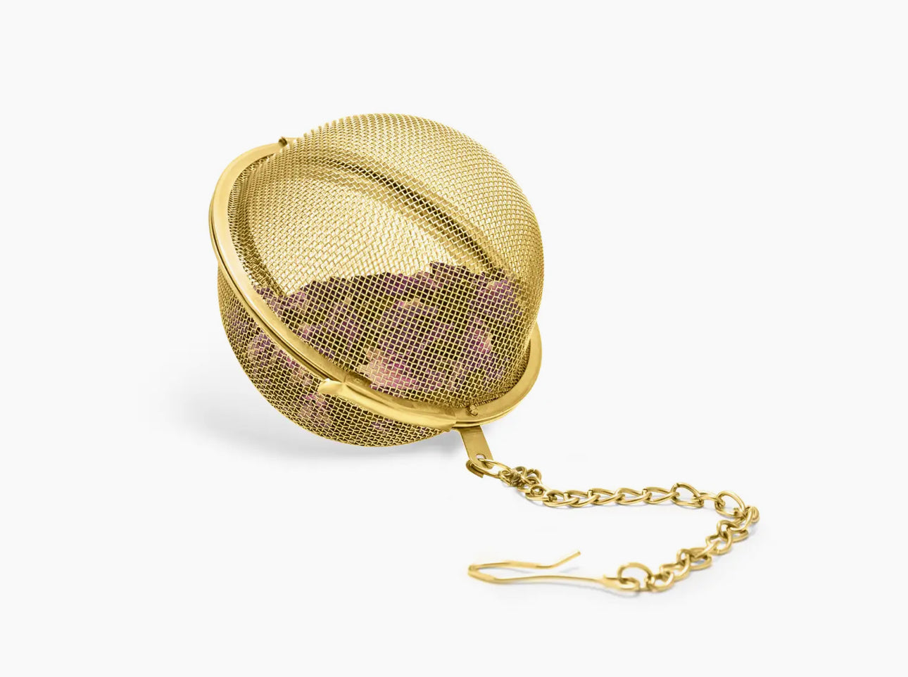 A stainless steel mesh ball in gold and a secure clamp keep loose leaves in.