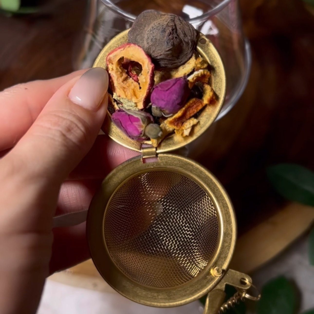 Herbal loose tea containing dried ingredients, including rose petals and dried fruits to aid with our digestion system.