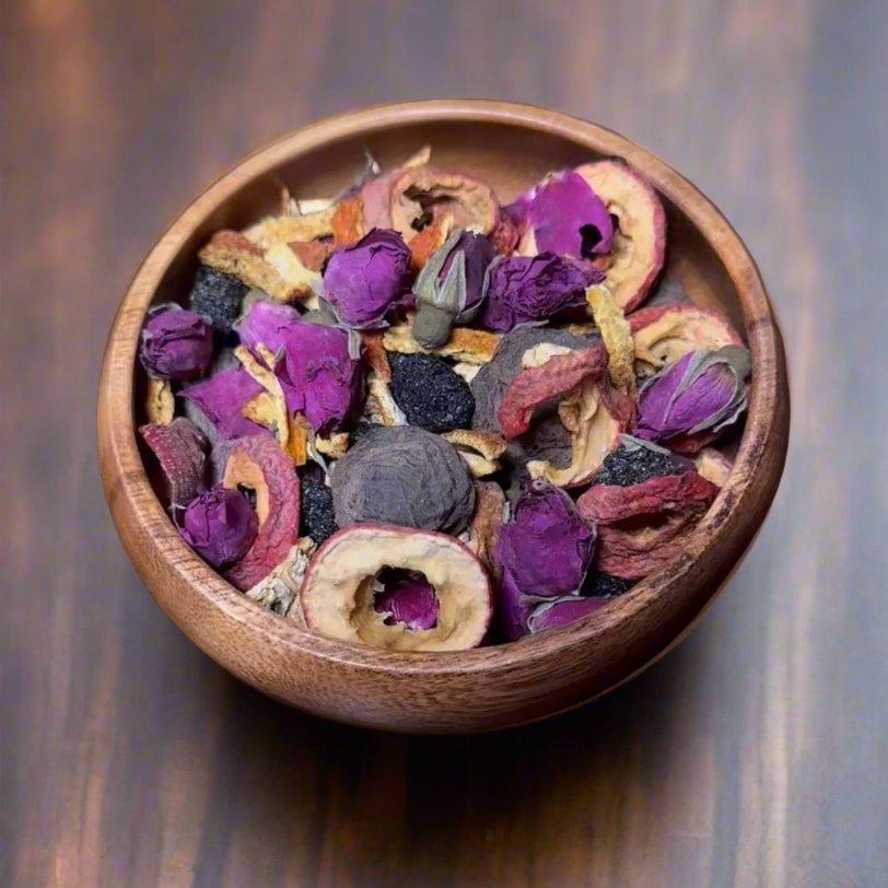 Herbal loose tea containing dried ingredients, including rose petals and dried fruits to aid with our digestion system.